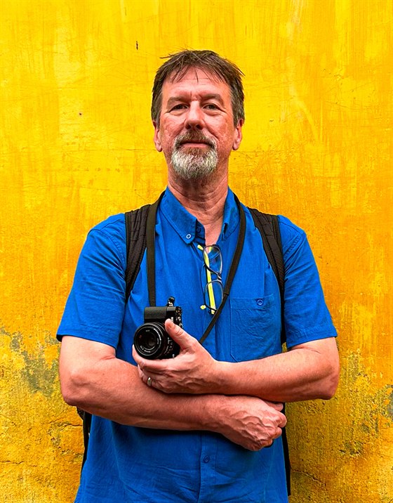 James Ackley holding a camera